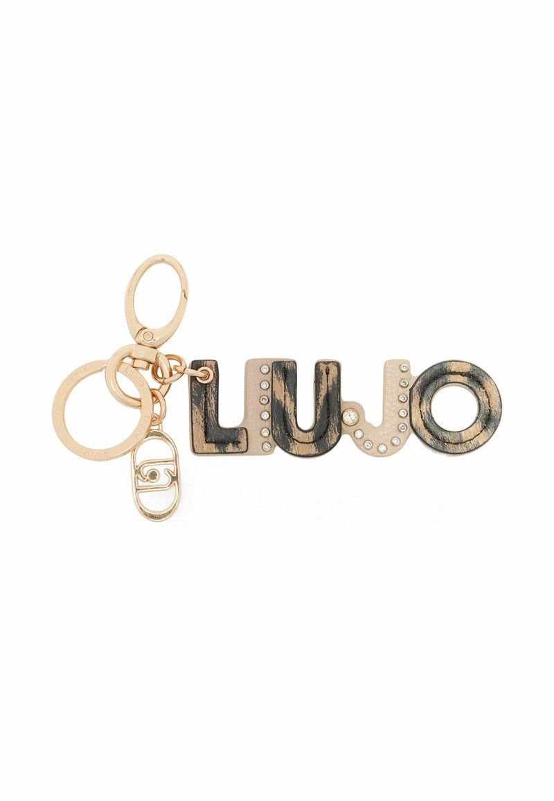 Nøglering med ordet "LUJO" i guld og sort med en tekstureret finish, accentueret af klare rhinsten og guldhardware.