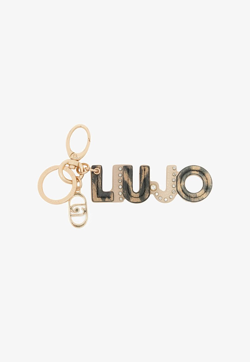Sleutelhanger met het woord "LUJO" in goud en zwart met een gestructureerde afwerking, verfraaid met heldere rhinestones en gouden hardware.