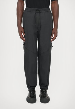 TRACK TROUSERS - Püksid - black