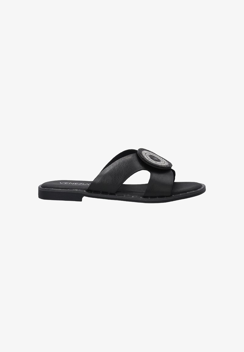 Black leather slide sandal with two crossed straps, featuring a circular decorative accent on the toe area and a flat rubber sole.