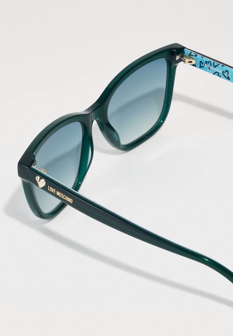 Love Moschino Green Teal Round Frame Sunglasses with Dark Lenses Moschino M3112 S 614 71 – Vintage Frames Company main image 4