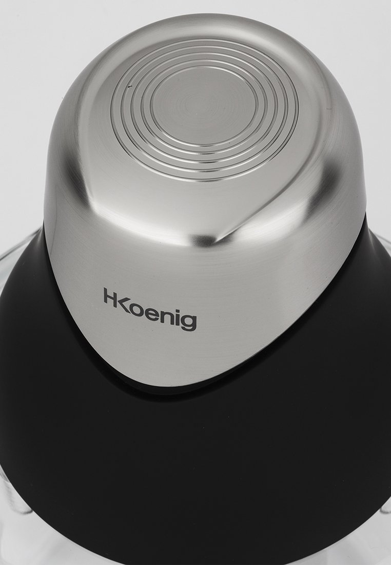 Bouilloire électrique HKoenig avec un couvercle en acier inoxydable, présentant un design texturé circulaire et un corps noir mat. Base en verre transparent visible.