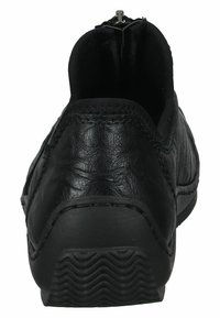 Black leather slip-on shoe with a rounded toe, elastic sides, visible stitching, and textured rubber outsole for grip.
