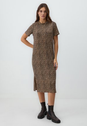 Leopard print midi dress in brown and black, short sleeves, round neckline, side slit, worn with black ankle boots. Soft, stretchy fabric.