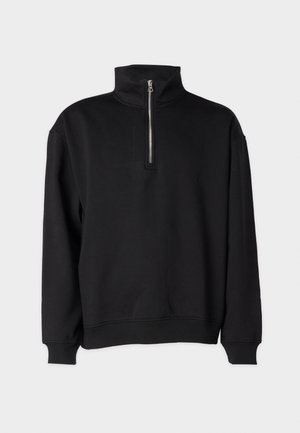 Black pullover sweatshirt with a high collar, featuring a half-zip closure, long sleeves, and ribbed cuffs and hem. Soft fabric texture.