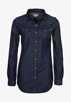 Dark blue denim shirt featuring long sleeves, a pointed collar, two front pockets with flaps, and button closure.