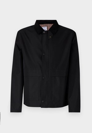 Casaco preto com fecho de botão à frente, duas grandes pocketas e colarinho de veludo cotelê em contraste. O interior apresenta um padrão xadrez. Material à prova d'água.