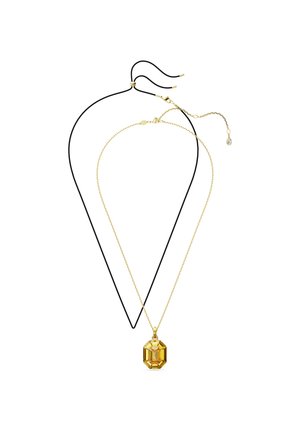 Two necklaces layered together: one is a thin black cord, the other is a gold chain with an octagonal yellow pendant featuring facets.