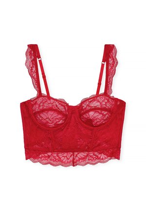 Punainen pitsinen bralette, jossa on aaltoilevat reunat, tukevat langat, säädettävät hihnat ja kukkakuosit. Pehmeä, läpinäkyvä materiaali ja lyhyt design.