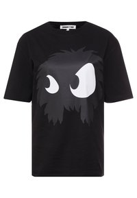Maglietta nera in cotone con un grande volto di mostro stilizzato in scala di grigi, caratterizzato da occhi bianchi prominenti e un design testurizzato simile al pelo.