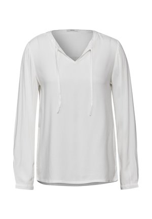 Chemise blanche à manches longues avec un col en V et des cordons de serrage ajustables. Tissu lisse et coupe décontractée avec des poignets aux poignets.