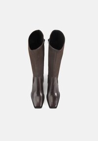 Brown leather knee-high boots with a smooth finish, square toe, and textured upper. Features side zippers for easy wear.