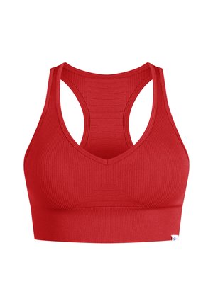 Bralette sportivo rosso a coste con scollatura a V e design a spalle scoperte. Presenta pannelli testurizzati e una fascia solida nella parte inferiore.