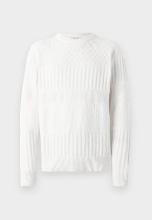 White knitted sweater featuring ribbed and diamond patterns, with a crew neckline and long sleeves, providing texture and layered design.
