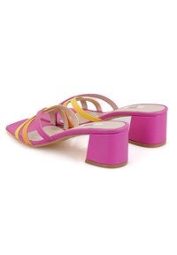 Pink and orange strappy heeled sandals with a square toe, a textured finish, and a thick, pink block heel.