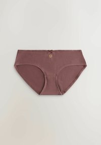 Culottes pour femmes en coton mauve avec un petit nœud et un emblème de soleil au centre de la ceinture, posées à plat sur un fond neutre.