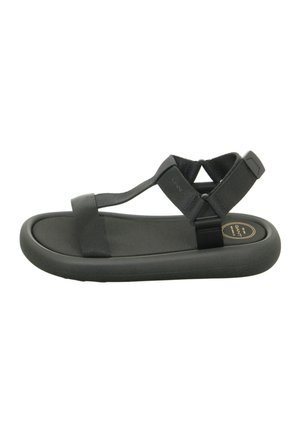 Black thong sandals with elastic straps and a cushioned sole. The design features a rounded toe and minimalistic style.