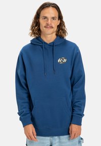 Navy blue hoodie made of soft fabric, featuring a front pocket, adjustable drawstrings, and a circular logo on the chest.