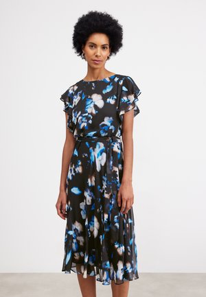 Floral dress featuring a black base with blue and white patterns, short flutter sleeves, a belt at the waist, and a flowy skirt.