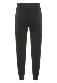 Black sweatpants made of soft fabric with an elastic waistband, tapered cuffs, and two back pockets. Minimalistic design without patterns.
