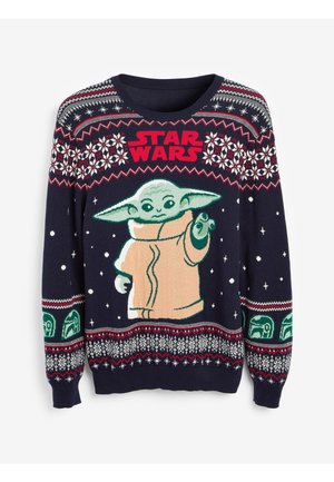 Granatowy sweter świąteczny z dużą grafiką postaci o zielonej skórze, ubranej w pomarańczową szatę, otoczonej białymi płatkami śniegu i wzorami geometrycznymi.