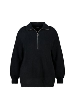 Zwart gebreide trui met een hoge kraag en een halve rits. Heeft brede mouwen en een losse pasvorm. De stof is overal textuurrijk.