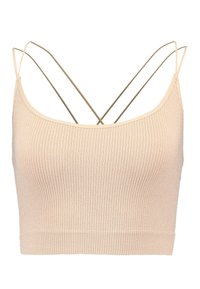 Beige ribbad crop top med tunna remmar och ett korsat ryggdesign. Tillverkad av ett elastiskt material med en subtil glans och slät textur.