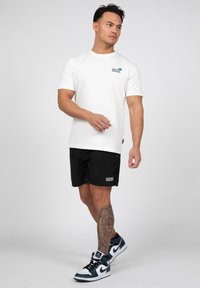 Wrong Friends MESSINA - Pantaloni sportivi - black