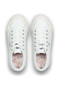 Pair of white low-top sneakers with laces, textured sides, "ROXY" labels, and floral-patterned pink insoles with a gold heart logo.