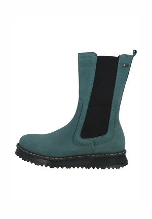 Türkisfarbener Wildleder-Stiefelette mit schwarzen elastischen Seiteneinsätzen, Gummisohle und kontrastierenden Nähten entlang der Sohle. Glatte Textur, schlichtes Design.