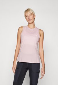 Light pink athletic tank top features a crew neckline, sleeveless design, and subtle white logo. Fabric appears smooth with a slight sheen.