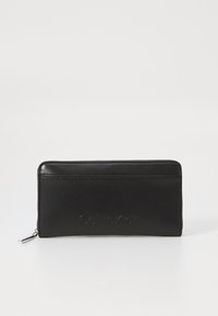 Calvin Klein EMBOSSED LOGO LARGE ZIP AROUND - Portafoglio - black