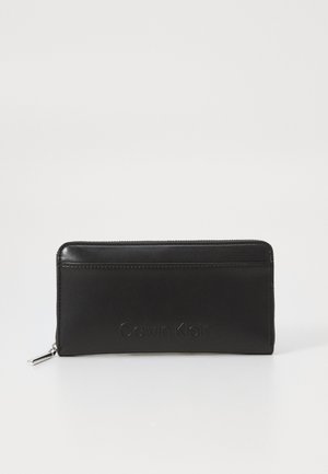 EMBOSSED LOGO LARGE ZIP AROUND - Monedero - black
