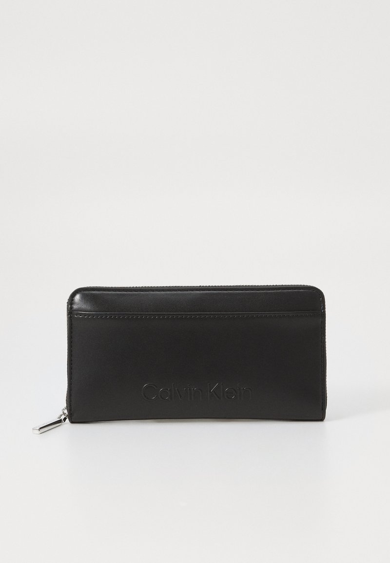 Calvin Klein EMBOSSED LOGO LARGE ZIP AROUND - Portafoglio - black