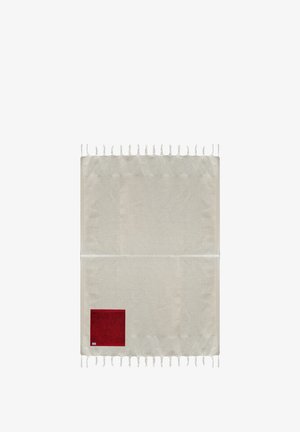 Light beige woven textile with fringed edges and a small dark red square accent in one corner. Smooth texture, rectangular shape.