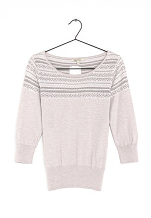 Light pink knit sweater with gray geometric patterns on upper chest and sleeves, hanging on black wire hanger.