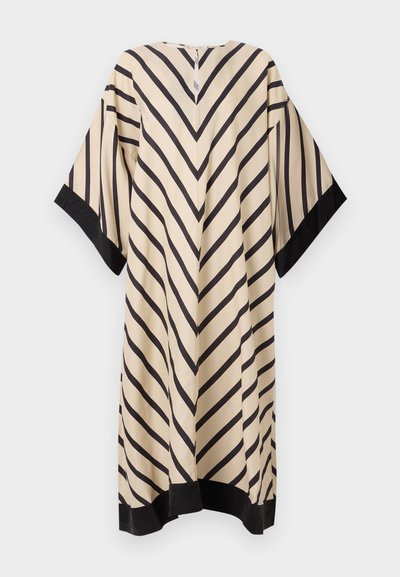 Beigs kleita ar melniem diagonāliem svītrām, platām piedurknēm un izliekta apmale. Gluda auduma ar pogu aizdari aizmugurē.