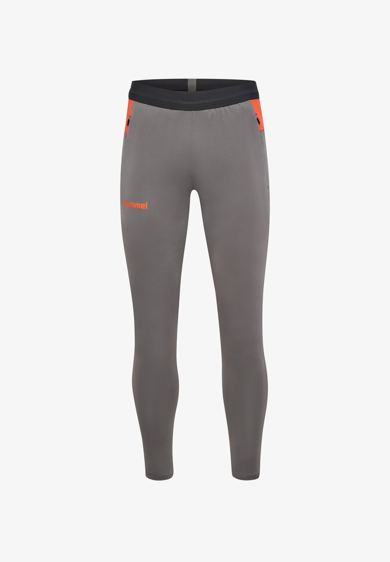 Grå träningsleggings med en åtsittande design, svart midjeresår och orange detaljer. Har sidofickor med dragkedja för förvaring.