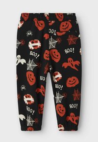 Zwarte instapbroek met een Halloween-thema patroon van rode pompoenen, spoken, spinnen en spinnenwebben. Elastische tailleband en manchetten.