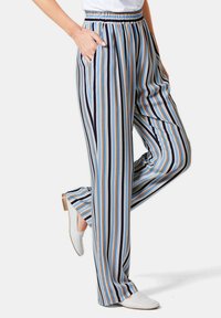 Gestreepte wijde broek met blauw, beige en marine-achtige kleuren, met een comfortabele elastische tailleband en zijzakken. Soepele stofstructuur.