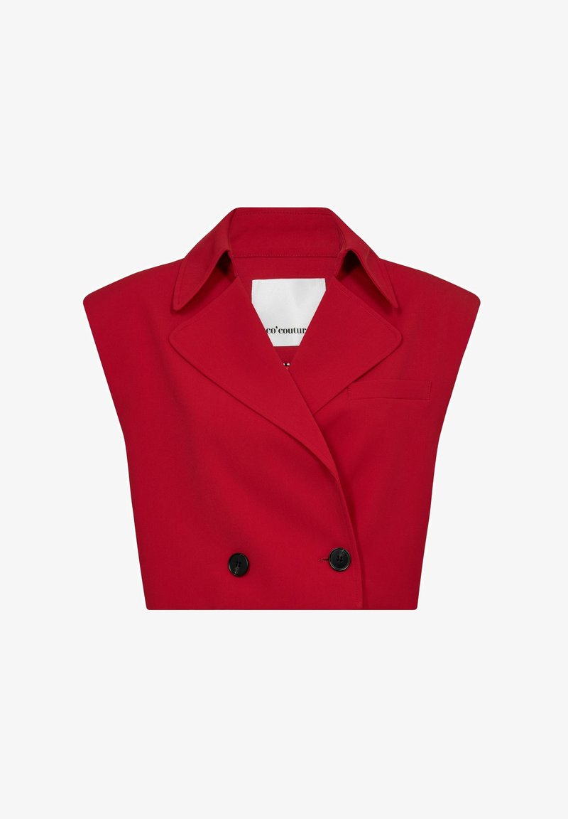 Röd dubbelknäppt jacka med stor krage, breda axlar och två svarta knappar. Slätt tyg med minimalistisk design och en bröstficka.