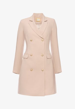 Beżowy płaszcz dwurzędowy o dopasowanym kroju, z długimi rękawami i dwiema przednimi kieszeniami. Posiada złote guziki oraz gładką teksturę materiału.