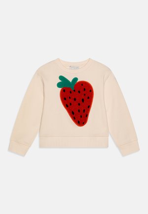 Light beige sweatshirt with a large red strawberry appliqué featuring green leaves. Soft fabric, crewneck, and ribbed cuffs and hem.