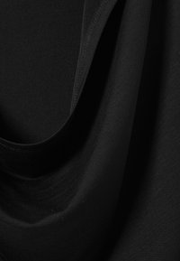 Black fabric showing a smooth, stretchy texture with draped sections. The material appears lightweight with a subtle sheen and fine stitching details.