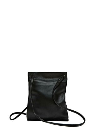 Black leather crossbody bag with a soft texture, drawstring closure, and a long adjustable strap. Minimalist design and no visible hardware.