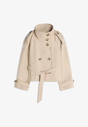 Beige puuvillaseoksen trenssitakki. Ominaisuuksiin kuuluu kaksirivinen etuosa, kuusi nappia, vyötäröllä vyö ja olkatoppaukset.