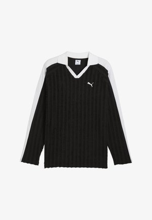 Black long-sleeve top with vertical ribbed texture, white collar, and side accents. Features a small white logo on the chest.