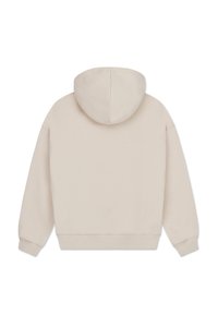 Beżowa bluza z kapturem, miękki materiał, luźny krój, ściągacze przy rękawach i na dole. Minimalistyczny design bez widocznych logo czy wzorów.