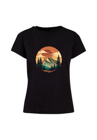 Black cotton t-shirt featuring a circular graphic of mountains and trees, with sunset colors including orange, green, and blue accents.