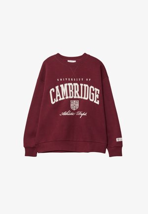 Bordeaux rød sweatshirt med teksten "University of Cambridge Athletic Dept." i hvid skrift og et lille våbenskjold under "Cambridge" på fronten.